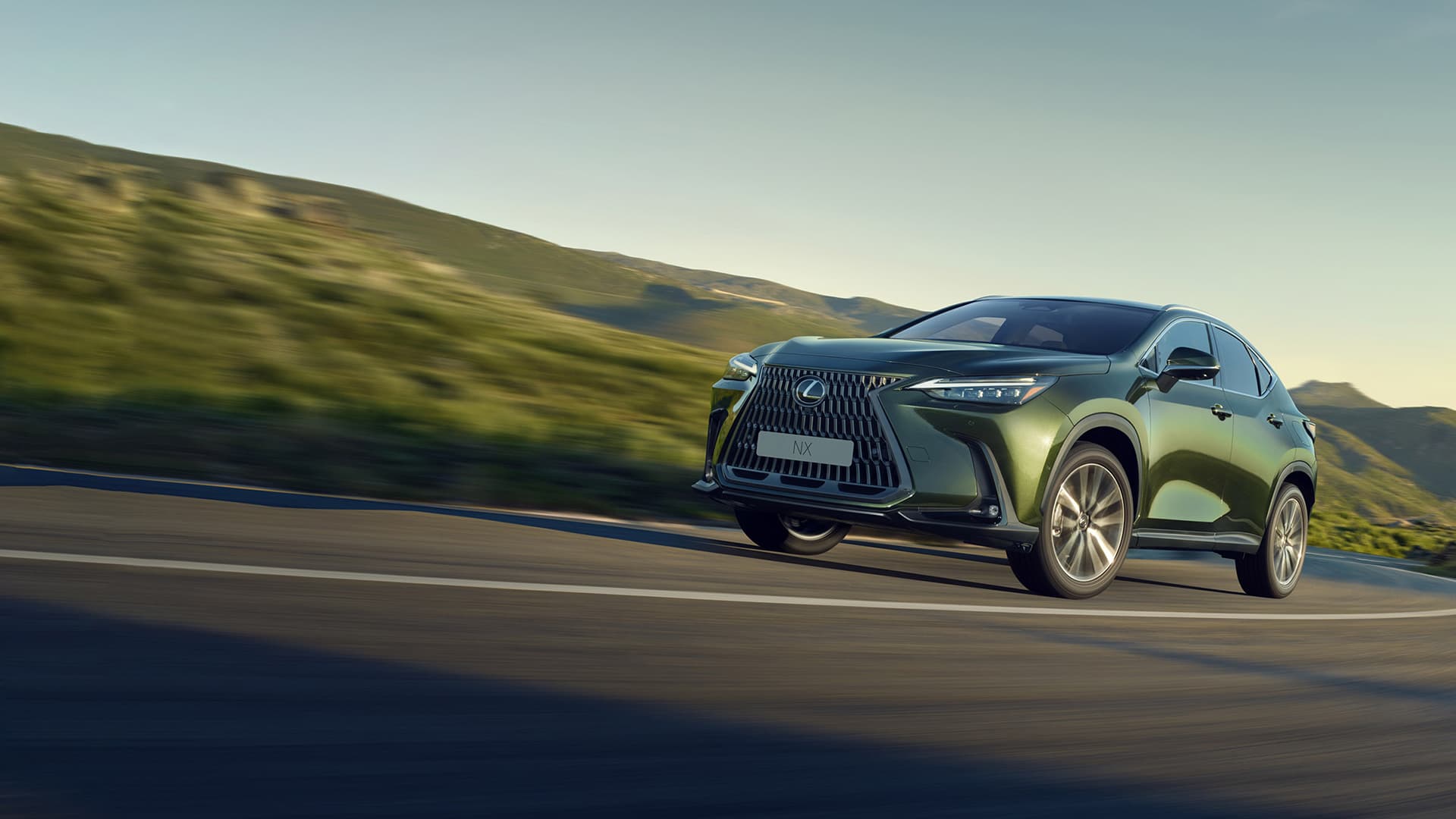 Silver NX being driven on the road.