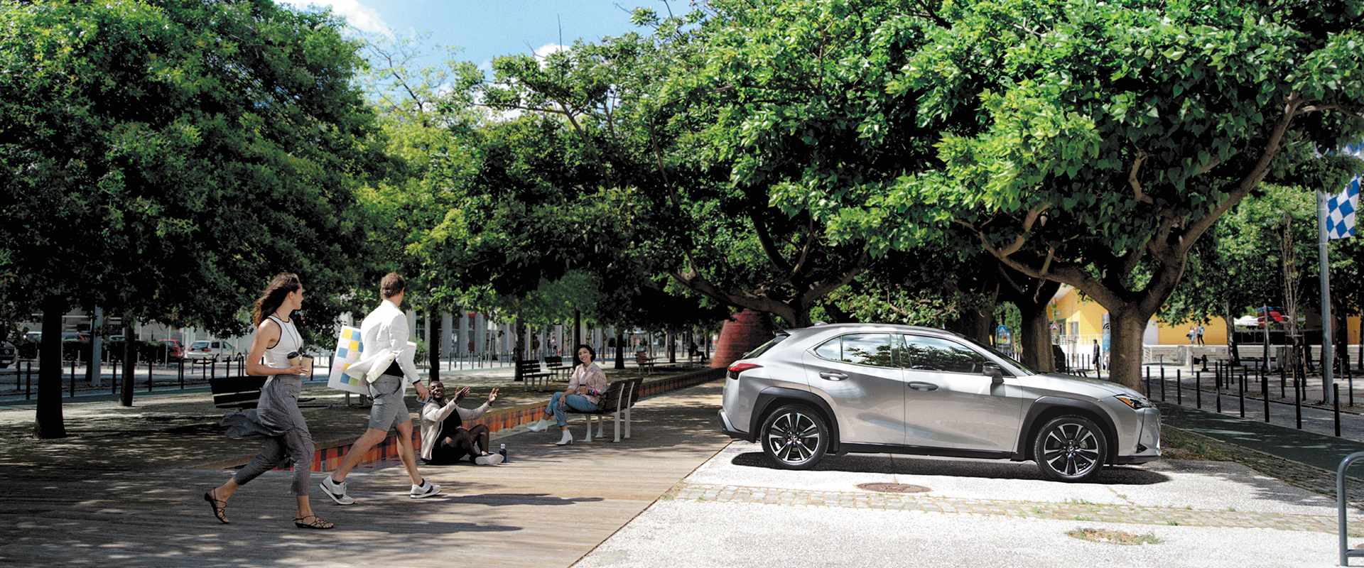 Silver UX being driven on the road.